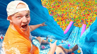 BIGGEST Backyard Water Slide With 100 MILLION ORBEEZ [upl. by Oilasor]