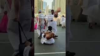 A pilgrim helping another pilgrim at the Haram Mosque in Makkah makkah shots viralvideo [upl. by Tlevesoor]