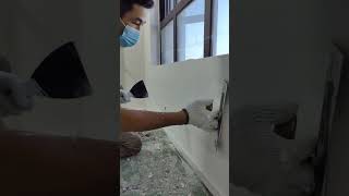 Renovation worker scraping putty [upl. by Blumenfeld]